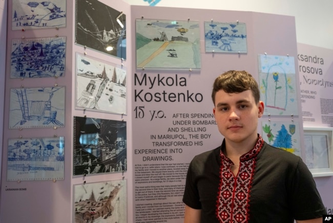 Drawings by Mykola Kostenko, pictured, are part of the War Diaries exhibition.(AP Photo/Peter Dejong)