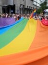 FILE - People carry a rainbow flag during the yearly Pride parade, known as the Equality Parade, in Warsaw, Poland, June 17, 2023. 