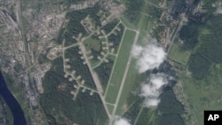 This satellite photo from Planet Labs PBC shows the Princess Olga Pskov International Airport in Pskov, Russia, Aug. 31, 2023. Satellite images analyzed by The Associated Press show that suspected Ukrainian drone attacks destroyed at least two planes at the Russian air base. 