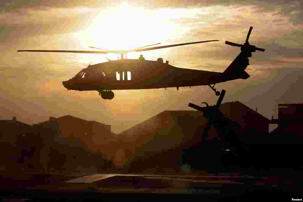 An Israeli military helicopter hovers above a helipad at a hospital following a mass-infiltration by Hamas gunmen from the Gaza Strip, in Ashkelon, southern Israel, on Oct. 7, 2023.