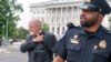 Penasihat Khusus John Durham (kiri), meninggalkan sidang tertutup Komite Tetap Intelijen di Capitol Hill, Washington, DC, Selasa, 20 Juni 2023. (AP/Jacquelyn Martin)