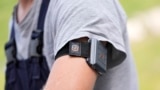 A SlateSafety armband is worn by Wyatt Fischer, a furnace mason employee at Cardinal Glass, Thursday, Aug. 22, 2024, in Menomonie, Wis. (AP Photo/Abbie Parr)