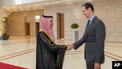 Suudi Arabistan Dışişleri Bakanı Prens Faysal bin Ferhan ve Suriye Cumhurbaşkanı Beşar Esat