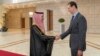 FILE - In this photo released by the Syrian official news agency SANA, Syrian President Bashar Assad, right, welcomes Saudi Minster of Foreign Affairs Faisal bin Farhan, left, ahead of their meeting in Damascus, Syria, April 18, 2023.