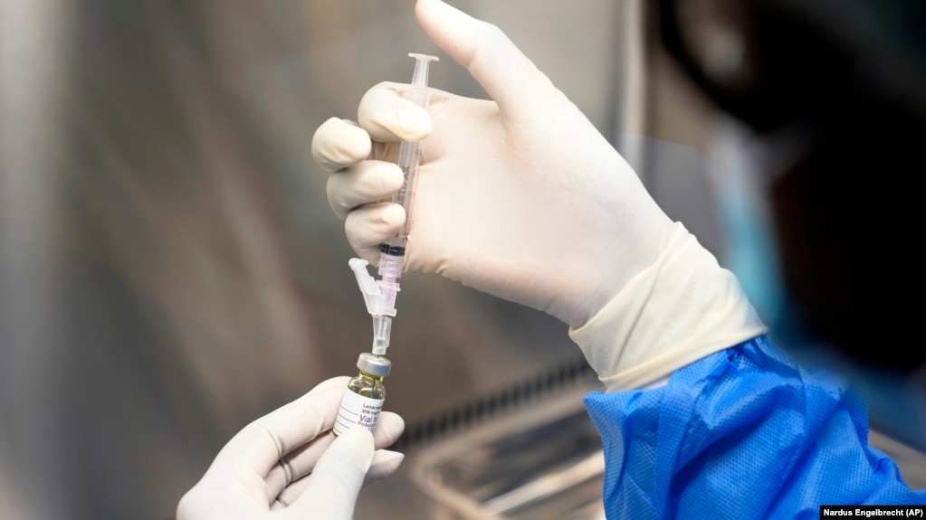 A pharmacist holds a vial of lenacapavir, the new HIV prevention injectable drug, at the Desmond Tutu Health Foundation's Masiphumelele Research Site, in Cape Town, South Africa, July 23, 2024. (AP Photo/Nardus Engelbrecht)