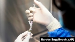 A pharmacist holds a vial of lenacapavir, the new HIV prevention injectable drug, at the Desmond Tutu Health Foundation's Masiphumelele Research Site, in Cape Town, South Africa, July 23, 2024. (AP Photo/Nardus Engelbrecht)