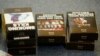 FILE - Mockups of cigarette packaging are shown in Ottawa, Ontario, May 31, 2016. In 2000, Canada became the first country to order graphic warnings on cigarette packages and in August 2023 will require warnings on individual cigarettes and cigars. 