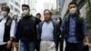 Mantan Wakil Ketua Aliansi Hong Kong untuk Mendukung Gerakan Demokrasi Patriotik Tiongkok, Albert Ho, berjalan setelah penangkapannya oleh polisi, di Hong Kong, China, 21 Maret 2023. (Foto: REUTERS/Tyrone Siu)