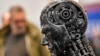 FILE - A metal head made of motor parts symbolizes AI, at the Essen Motor Show in Essen, Germany, Nov. 29, 2019. Efforts to come up with rules to ensure AI's trustworthiness come as governments worldwide are exploring the impact of the technology.