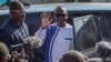 FILE - Chadian opposition leader Succes Masra (C) waves while arriving to a polling station to cast his vote during the constitutional referendum in N'Djamena, on Dec. 17, 2023.