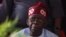 FILE: Presidential candidate Bola Tinubu looks on in Abuja on March 1, 2023 during celebrations at his campaign headquarters. Tinubu's win is being challenged by six opposition-dominated Nigerian states.
