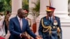 FILE - Chief of Kenya Defense Forces General Francis Ogolla (R) speaks to Kenyan President William Ruto as they prepare to receive Britain's King Charles III and Queen Camilla during the ceremonial welcome at the State House in Nairobi on Oct. 31, 2023.