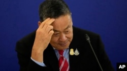 FILE - Thailand's Prime Minister Srettha Thavisin gestures as he talks to media during a news conference at the government house in Bangkok, Thailand, April 10, 2024. 