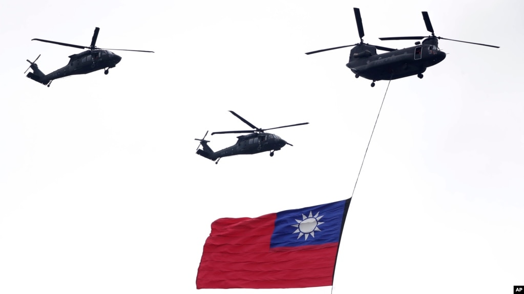 Helicopters fly over with Taiwan national flag during an inauguration celebration of Taiwan's President Lai Ching-te in Taipei, Taiwan, on May 20, 2024. 