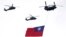 Helicopters fly over with Taiwan national flag during an inauguration celebration of Taiwan's President Lai Ching-te in Taipei, Taiwan, on May 20, 2024. 