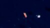 FILE - In this satellite photo provided by Planet Labs PBC, vessels identified as the Virgo, left, and the Suez Rajan, by the advocacy group United Against Nuclear Iran, are seen in the South China Sea on Feb. 13, 2022. 