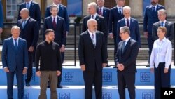 Britain's Prime Minister Keir Starmer, second right, and Ukrainian President Volodymyr Zelenskyy, second left, pose for a photo with other leaders during the European Political Community Summit at Blenheim Palace in Woodstock, Britain, July 18, 2024.