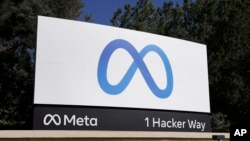 FILE - Meta's logo is seen at company headquarters in Menlo Park, California, Oct. 28, 2021. 