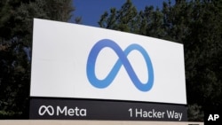 FILE - A sign advertises Meta's headquarters in Menlo Park, California, Oct. 28, 2021. On Thursday, a U.S. appeals court revived a software engineer's proposed class action claiming Meta Platforms refused to hire him because it preferred hiring foreign workers paid lower wages.