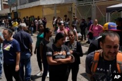 Families gather outside the Boleita National Police detention center after their loved ones were detained in recent days during opposition protests against the official results of the presidential election, in Caracas, Venezuela, Aug. 1, 2024.