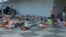 Attendees at the World Scout Jamboree lie down to rest at a camping site in Buan, South Korea, Aug. 4, 2023. 