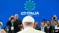 Pope Francis sits during a working session on AI, Energy, Africa and Mideast, at the G7, in Borgo Egnazia, near Bari, southern Italy, June 14, 2024.