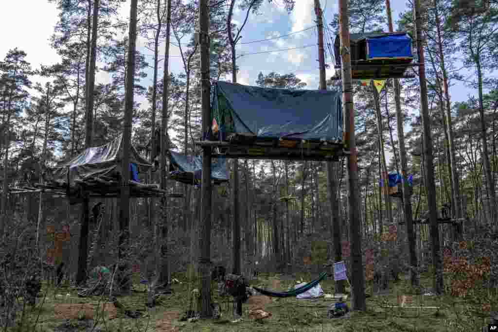 A view of tree houses set up by activists near the Tesla Gigafactory for electric cars in Gruenheide near Berlin, Germany, March 5, 2024.&nbsp;Production at Tesla&#39;s electric vehicle plant in Germany came to a standstill and workers were evacuated after a power outage that officials suspect was caused by arson.&nbsp;