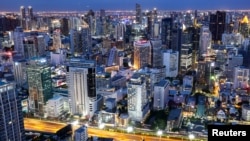 FILE — Bangkok's skyline is photographed during sunset in Bangkok, Thailand, July 3, 2023. Chinese real estate investors who once snapped up condos and apartments in Thailand are scaling back due to an economic downturn and real estate crisis at home.  