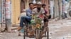 FILE - People carry an injured protester in a cycle rickshaw to a hospital after he was shot at by the police during a protest against Prime Minister Sheikh Hasina and her government, in Dhaka, Bangladesh, Aug. 5, 2024.