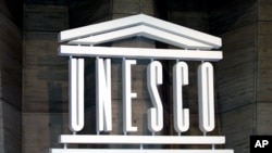 FILE - The UNESCO logo is seen at the 31st session of the General Conference of UNESCO in Paris, Oct. 15, 2001.
