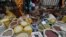 FILE - Vendors sell beans and rice in a street market in Kabete, on the outskirts of Nairobi on June 8, 2015.