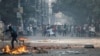 Supporters of the Bangladesh Nationalist Party throw bricks toward police during a clash in Dhaka, Bangladesh, Oct. 28, 2023.