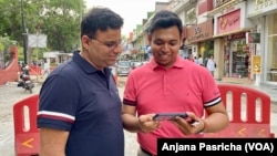 Abhay Dang and Supriyo Chakraborty visit a market in New Delhi, April 20, 2023.