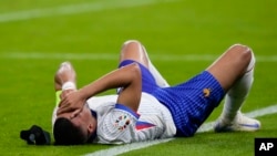 Kylian Mbappe of France reacts after an injury during a quarter final match between Portugal and France at the Euro 2024 soccer tournament in Hamburg, Germany, July 5, 2024.