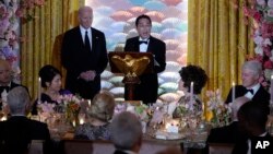 FILE - President Joe Biden listens as Japanese Prime Minister Fumio Kishida speaks ahead of a toast during a State Dinner at the White House, Apr. 10, 2024.