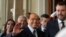 FILE - Forza Italia's president Silvio Berlusconi waves, center, flanked by The League leader Matteo Salvini, right, and Senator Licia Ronzulli, left, as they arrive at the Quirinale Presidential Palace, Oct. 21, 2022.
