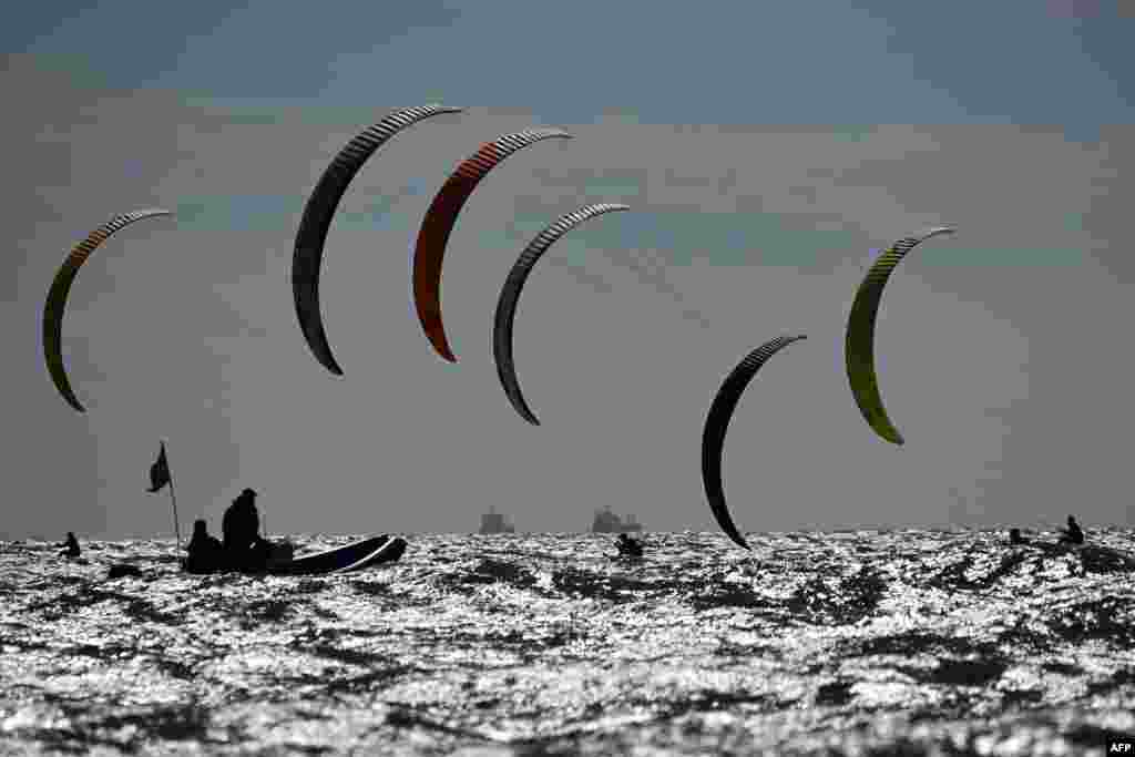 Competitors race during the final day of the 2023 Formula Kite European Championships, in Portsmouth, southern England.