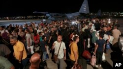 Jordanians evacuated from Sudan arrive at a military airport in Amman, Jordan, April 24, 2023. Despite the Kenyan government's efforts, parents of university students still in Sudan have appealed to the government to evacuate them before fighting resumes.