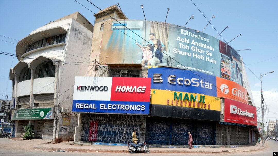 Pakistani shopkeepers close their businesses during a strike against inflation in Karachi, Pakistan, on Sept. 2, 2023.