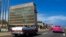 FILE - Tourists in classic cars pass the U.S. Embassy in Havana, Cuba, Oct. 3, 2017. Brain injuries known as the “Havana Syndrome” were first reported by some American diplomats who were posted in Cuba.