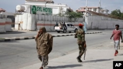 FILE - Somali security forces guard the entrance to the SYL hotel in Mogadishu, Dec. 11, 2019. The extremist group al-Shabab said March 14, 2024, that its fighters had attacked and penetrated the hotel, which is not far from the presidential palace.