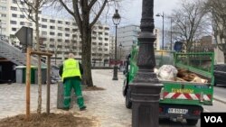 A private garbage collector is seen in northern Paris. Some city neighborhoods have been spared by the strike. (Lisa Bryant/VOA)