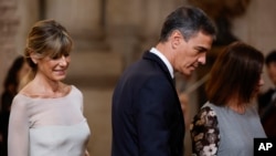 FILE - Spain's Prime Minister Pedro Sanchez and his wife Begona Gomez, left, attend commemorations marking the 10th anniversary of the proclamation of Spain's King Felipe VI at Royal Palace in Madrid, June 19, 2024.