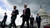 FILE - U.S. senators walk to a press conference to call on U.S. President Joe Biden to negotiate with Republicans in order to make a deal on raising the debt ceiling on Capitol Hill, May 3, 2023. Biden, House Speaker Kevin McCarthy and others are meeting May 16 for further talks.