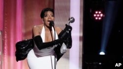 Fantasia Barrino, a cast member in 'The Color Purple,' accepts the award for Outstanding Actress in a Motion Picture during the 55th NAACP Image Awards, March 16, 2024, at The Shrine Auditorium in Los Angeles. (AP Photo/Chris Pizzello)