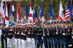 Troops march to their places during an Armed Forces Farewell Tribute in honor of Joint Chiefs Chairman Gen. Mark Milley at Joint Base Myer-Henderson Hall, Sept. 29, 2023, in Fort Myer, Va.