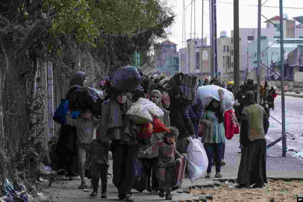 Palestinians arrive in the southern Gaza town of Rafah after fleeing an Israeli ground and air offensive in the nearby city of Khan Younis.&nbsp;Israel has expanded its offensive in Khan Younis, saying the city is a stronghold of the Hamas militant group.