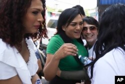 Monica Linares, an activist for the ASPIDH Arcoiris Trans organization, and others gather for a protest to demand the approval of a Gender Identity Law, in San Salvador, El Salvador, May 17, 2023.