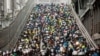 Motorcyclists ride down from the exclusive motorcycle lane of the Taipei Bridge during the morning commute in Taipei, Taiwan, May 22, 2024.