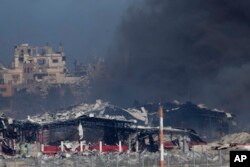 Smoke rises following an Israeli bombardment in the Gaza Strip, as seen from southern Israel, Dec. 16, 2023.